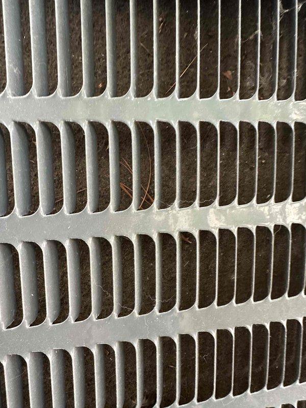 Completed preventative maintenance service on residential cooling system as part of recurring maintenance program. Inspected condenser coil and identified moderate accumulation of dirt, debris, and lint between fins; performed thorough cleaning to restore optimal heat transfer efficiency. Verified furnace and air handler components, confirmed proper operation of all system controls, and ensured all safety labels and equipment specifications remain visible and intact for ongoing compliance.