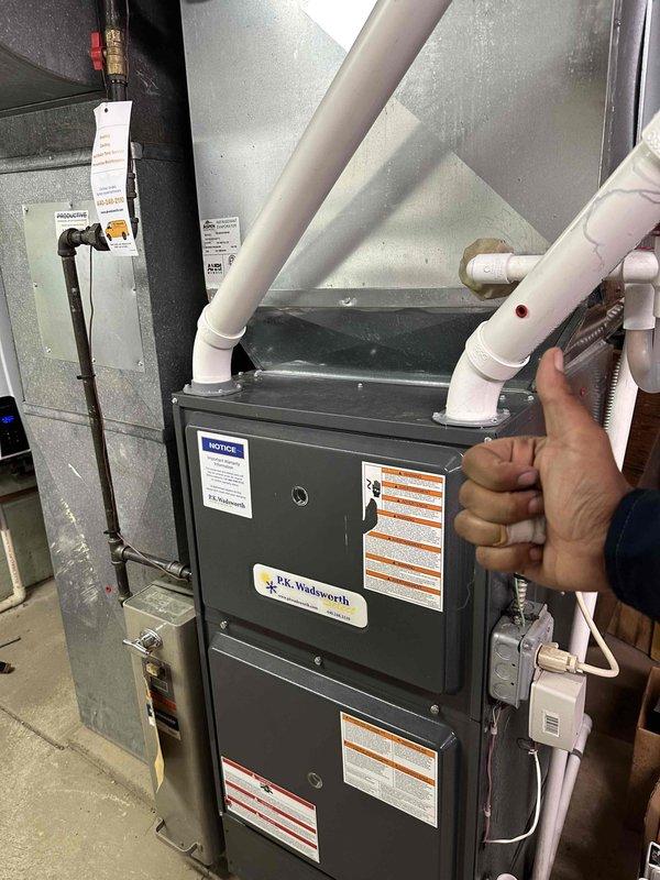 Completed preventative maintenance service on residential cooling system as part of recurring maintenance program. Inspected condenser coil and identified moderate accumulation of dirt, debris, and lint between fins; performed thorough cleaning to restore optimal heat transfer efficiency. Verified furnace and air handler components, confirmed proper operation of all system controls, and ensured all safety labels and equipment specifications remain visible and intact for ongoing compliance.