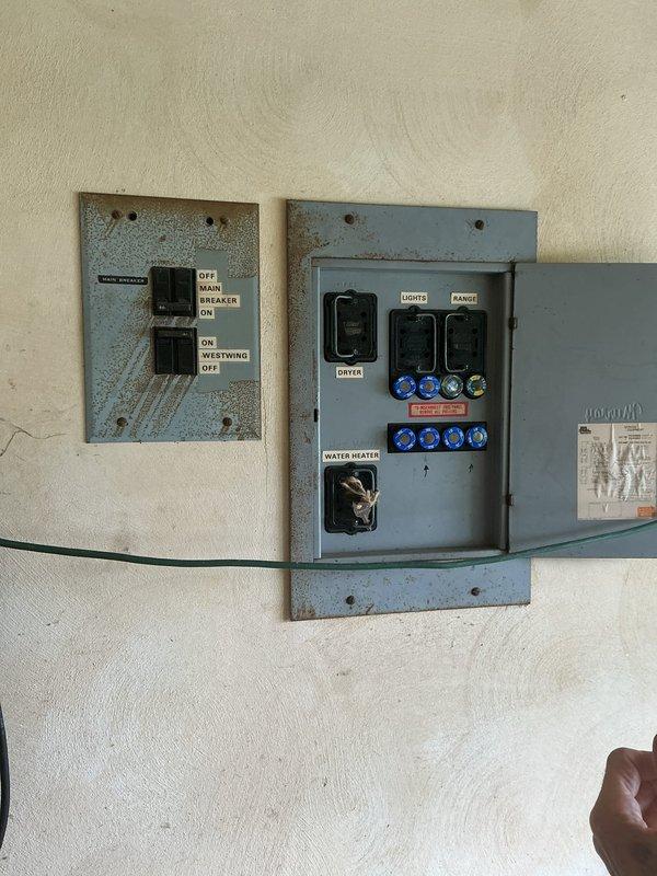 Completed electrical panel upgrade by replacing obsolete fuse box system with modern circuit breaker panel. Installation included new main breaker, branch circuit breakers for lights, range, dryer, and water heater, ensuring improved safety and code compliance for the residential electrical system.