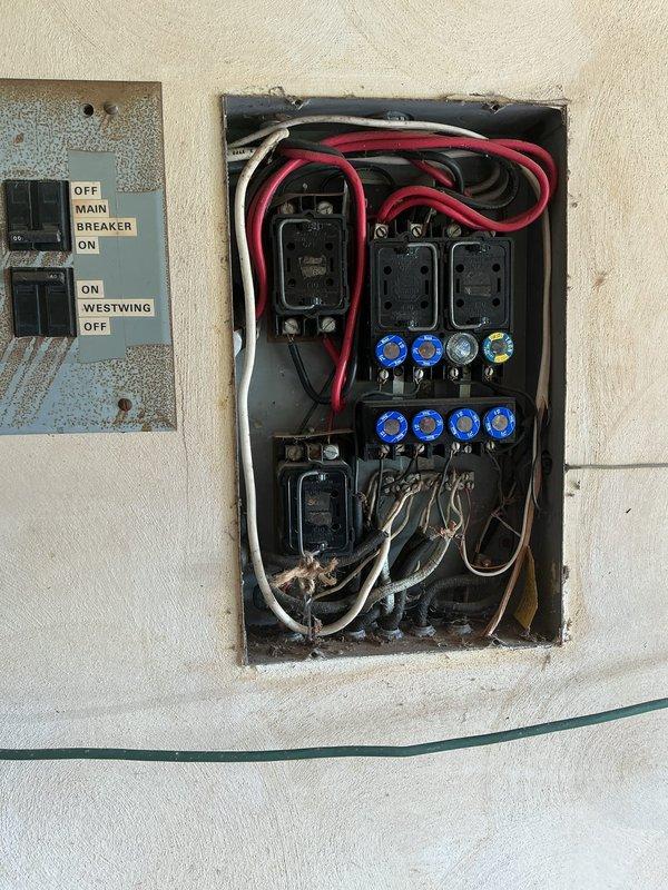 Completed electrical panel upgrade by replacing obsolete fuse box system with modern circuit breaker panel. Installation included new main breaker, branch circuit breakers for lights, range, dryer, and water heater, ensuring improved safety and code compliance for the residential electrical system.