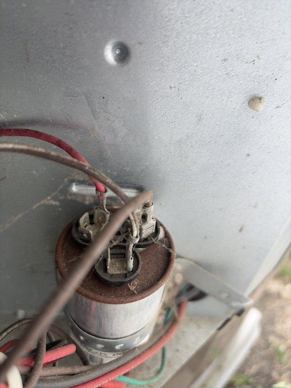 Completed scheduled preventive maintenance on residential air conditioning system. Inspected electrical components including contactor relay and run capacitor, documented existing corrosion on capacitor terminals and housing, verified all wire connections secure, and confirmed system operational status per maintenance agreement protocol.
