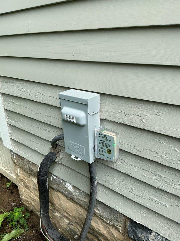 Responded to service call for loud noise complaint on 3-year-old outdoor air conditioning unit affecting entire home. Upon arrival, performed comprehensive system inspection including visual assessment of condenser unit exterior, fan assembly, and electrical components. Examined unit housing, fan grille, and top panel for signs of debris, damage, or mechanical failure. Inspected electrical disconnect box and associated wiring for proper connections and potential issues. Evaluated condenser coil access points and secured fasteners. Documented unit condition through photographic evidence showing fan assembly configuration and external components. Diagnosed noise source and verified system operational status to restore normal cooling function to residence.