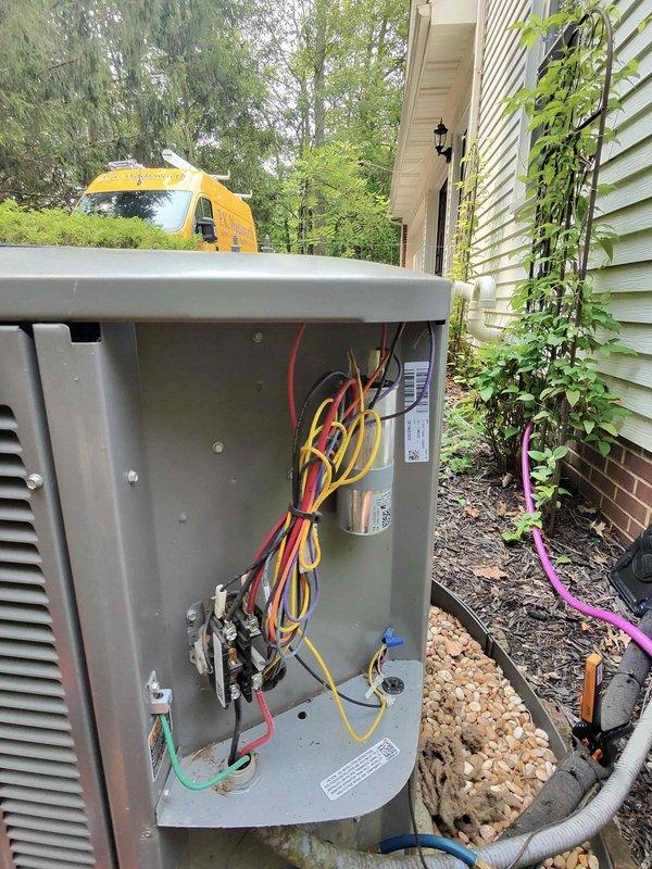 Responded to callback for persistent water leak that worsened after previous service visit. Inspected refrigerant line penetration through ceiling/floor where condensation was occurring due to inadequate insulation and improper sealing. Resealed pipe penetration with foam sealant and verified insulation integrity on suction line. Checked electrical disconnect box and capacitor connections to ensure system was operating at proper specifications to prevent excessive condensation from improper cycling.