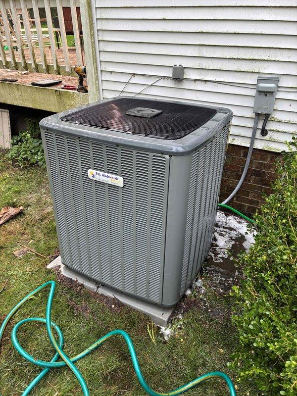 Replaced failed condenser fan motor on outdoor AC unit and performed thorough coil cleaning to restore proper system operation. The condenser coils were heavily soiled with dirt and debris accumulation, which was removed to improve heat transfer efficiency and airflow. System tested and confirmed operational upon completion.