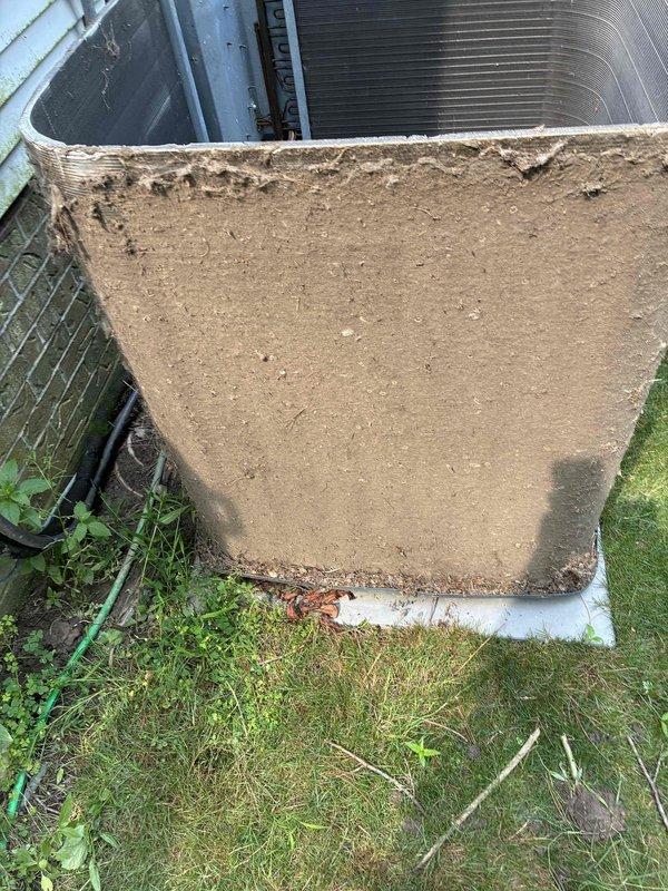 Replaced failed condenser fan motor on outdoor AC unit and performed thorough coil cleaning to restore proper system operation. The condenser coils were heavily soiled with dirt and debris accumulation, which was removed to improve heat transfer efficiency and airflow. System tested and confirmed operational upon completion.