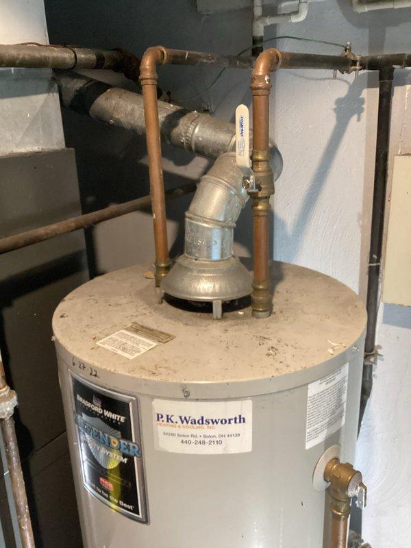 Responded to service call for Bradford White tanked water heater with pilot light repeatedly extinguishing. Upon arrival, inspected gas control valve, thermocouple, and pilot assembly for proper operation and positioning. Cleaned pilot orifice and thermocouple sensor to remove dust and debris accumulation. Tested flame sensor continuity and verified adequate millivolt signal generation. Checked gas supply pressure and confirmed proper venting with no blockages or backdraft conditions. Cycled pilot light multiple times to verify reliable ignition and flame retention. All plumbing connections, pressure relief valve, and gas line fittings inspected with no leaks detected. Unit restored to normal operation with stable pilot light and burner function confirmed.