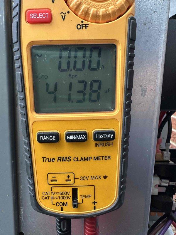 Performed comprehensive cooling system maintenance inspection and diagnostics. Conducted electrical testing using clamp meter, measuring amperage and capacitance readings to verify proper system operation. Inspected interior components, noting oxidation and corrosion on metallic elements, debris accumulation within housing, and general wear consistent with normal system aging. Verified electrical connections and refrigerant lines for integrity and proper function.