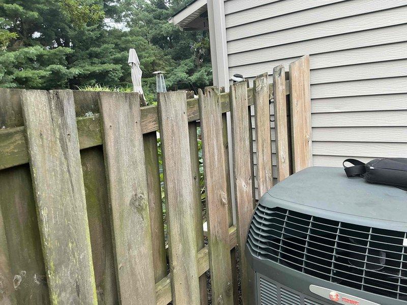 Conducted comprehensive evaluation of 19-year-old residential HVAC system for replacement estimate, including outdoor air conditioning unit and basement furnace installation. Documented existing equipment conditions through photographic assessment, noting exterior condenser placement against property siding and complete basement mechanical room setup with furnace, air handler, and associated ductwork and plumbing connections.