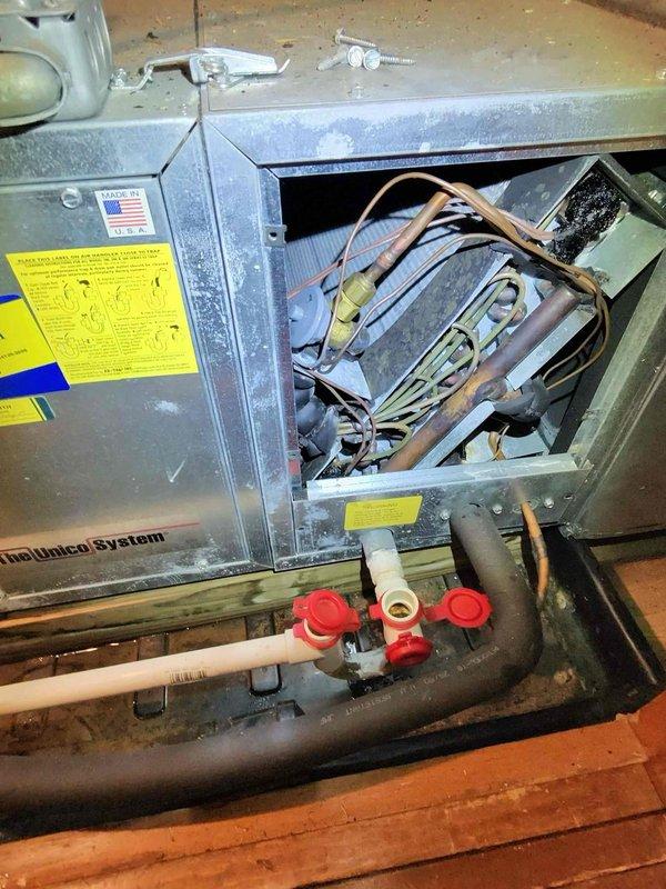 Responded to service call for leaking EZ trap on Unico System HVAC unit. Removed access panel to inspect internal components and located failed condensate trap assembly. Replaced defective EZ trap with new unit, verified proper drainage function, and confirmed no additional leaks present. Reinstalled access panel and tested system operation to ensure proper functionality.