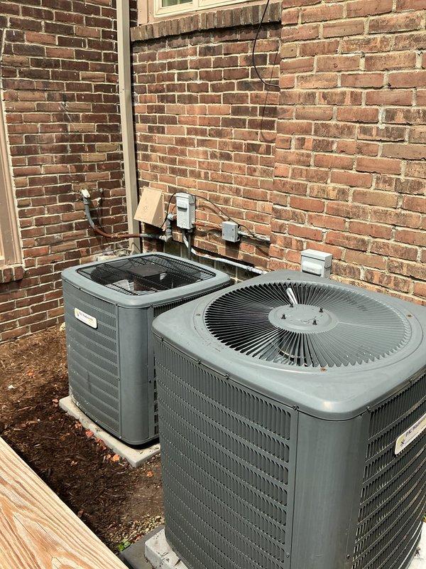 Completed comprehensive cooling maintenance on two outdoor HVAC condensing units installed side by side on exterior concrete pads. Performed standard preventive maintenance procedures including inspection of electrical components, capacitors, and wiring connections within control panels, verification of proper system operation, and documentation of equipment condition through photographs.