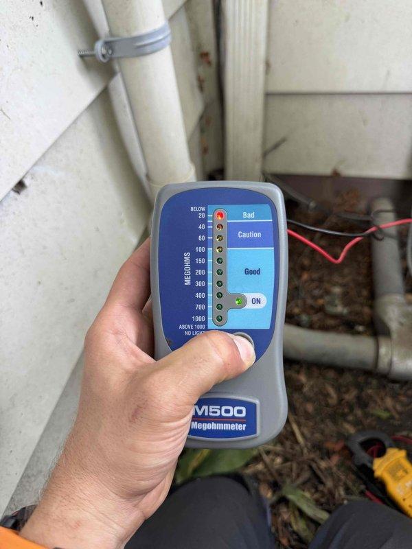 Responded to no cooling call and performed diagnostic evaluation of air conditioning system. Tested electrical components at main panel and verified circuit breaker operation. Conducted insulation resistance testing using megohmmeter on compressor windings, with readings indicating electrical integrity of motor. System restored to normal operation.