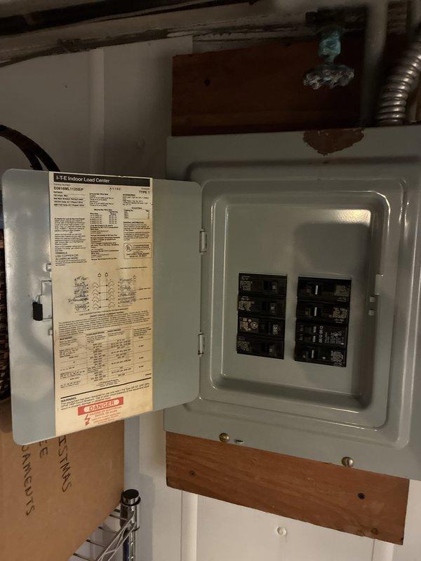 Conducted comprehensive HVAC system evaluation for property currently operating two separate systems. Assessed existing thermostat controls, electrical panel capacity, and current system configurations to determine feasibility of consolidating to a single air conditioning system. Documented electrical infrastructure including ITE Indoor Load Center specifications and circuit breaker layout to evaluate whether existing electrical service could support a larger-capacity single system versus maintaining dual systems. Provided multiple AC replacement options and recommendations based on home layout, electrical capacity, and customer preferences for system consolidation.