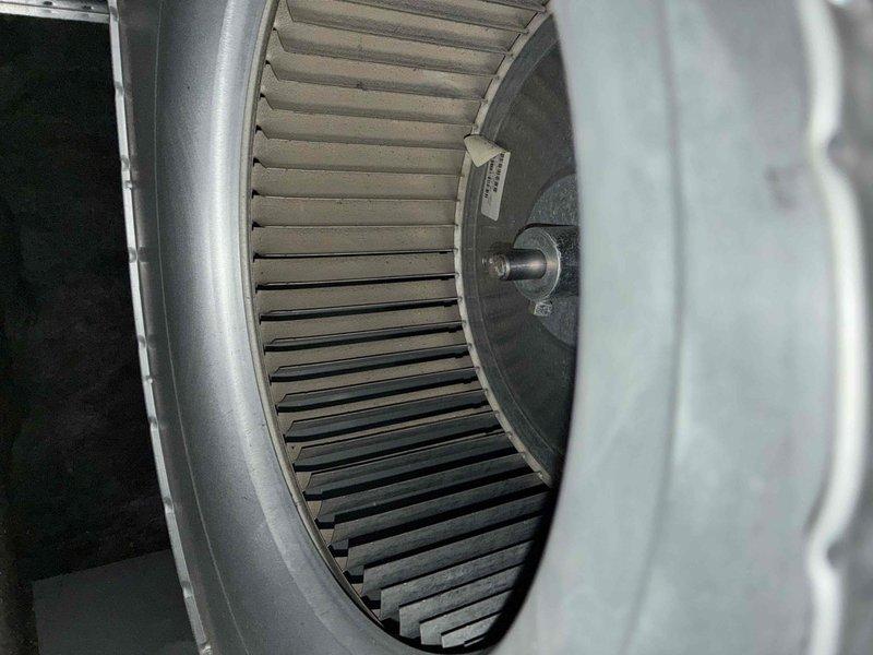 Completed comprehensive cooling system tune-up and inspection of air handler unit. Inspected and verified proper operation of blower wheel assembly, confirmed all blades intact and clean with no obstructions or debris accumulation. Noted minor residue buildup in condensate drain pan area; system operational and performing within normal parameters.