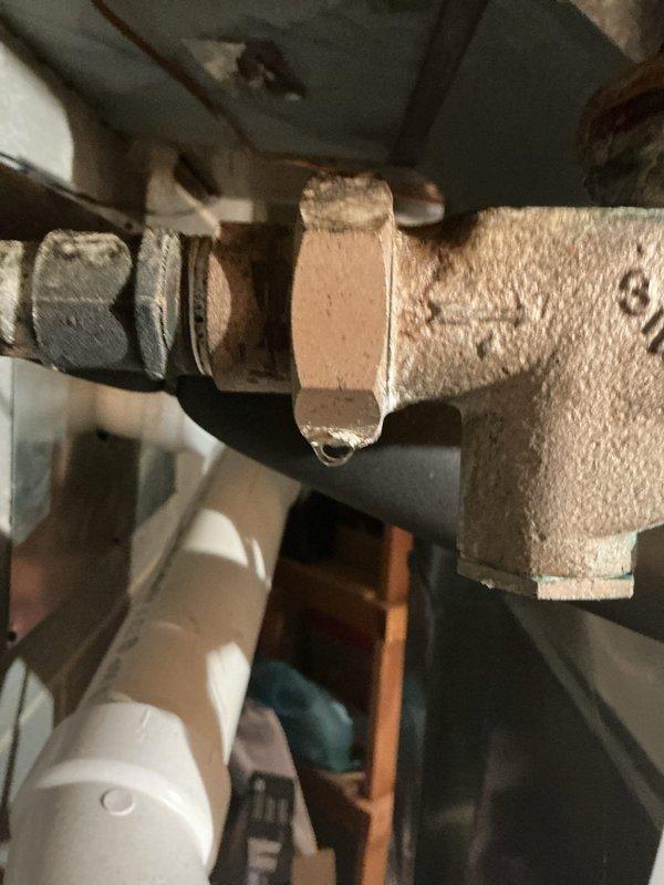 Performed routine maintenance on tanked water heater system, including complete flush to remove sediment buildup and ensure optimal performance. Inspected all associated plumbing connections, pressure relief valve, and supply lines, noting existing oxidation on brass fittings and pressure regulator valve consistent with normal aging of components; all connections remain secure and functional with no active leaks detected.