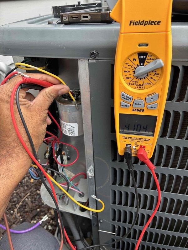 Performed routine maintenance on aging cooling system. Conducted electrical diagnostics using digital multimeter, measuring capacitor performance and verifying proper voltage readings at control board and electrical components. Inspected circuit board and internal wiring connections. System found to be operating properly following maintenance procedures.