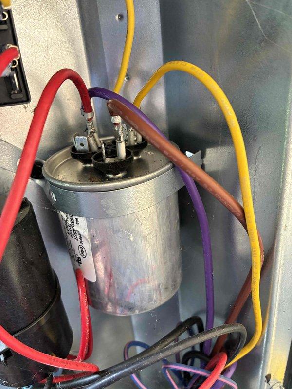 # HVAC Cooling Maintenance Summary

Completed routine preventive maintenance on residential air conditioning system. Performed comprehensive inspection of electrical components, including capacitor examination with verification of proper wire connections and terminal integrity. Conducted thorough assessment of evaporator coil, noting minor debris accumulation on fin surfaces. Cleaned condenser coil fins to restore optimal heat transfer efficiency and airflow. All system components found operational with no immediate repairs required.