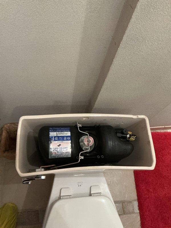 Completed comprehensive whole home plumbing inspection during afternoon visit. Thoroughly examined and documented water heater installation including A.O. Smith unit with expansion tank, copper supply lines, brass fittings, shut-off valves, and pressure regulation components. Inspected toilet flush valve mechanism and internal tank components to verify proper operation and functionality.