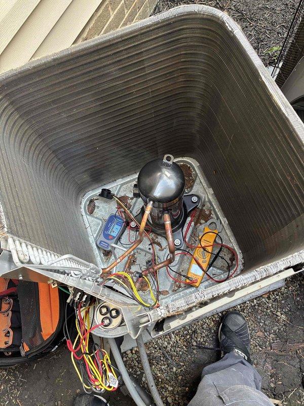 Responded to no cooling complaint on residential air conditioning system. Performed diagnostic testing on outdoor condensing unit using digital multimeters to measure electrical values at compressor and associated components. Evaluated compressor operation, refrigerant line connections, and internal wiring. Identified system malfunction through systematic electrical troubleshooting procedures.