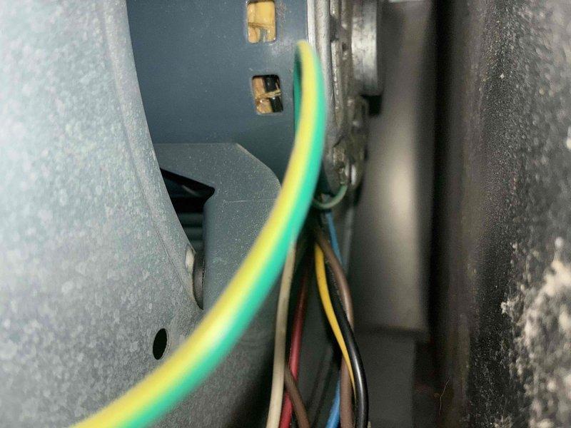 Completed scheduled preventive maintenance on residential cooling system. Performed comprehensive inspection of furnace and air handler unit, including examination of blower motor assembly, electrical connections, and control boards. Verified all wire terminations were secure at terminal blocks, confirmed proper grounding connections, and ensured all electrical components were functioning within normal parameters. System operational with green indicator light confirming normal status.