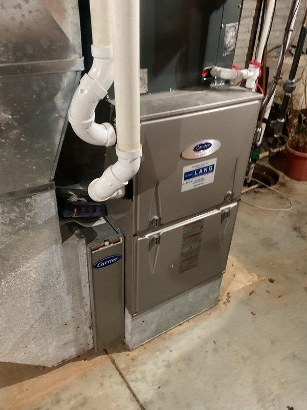 # HVAC Cooling Maintenance Completed

Performed comprehensive preventive maintenance on residential split-system air conditioning unit as part of ongoing seasonal service agreement. Conducted thorough inspection of indoor Carrier furnace/air handler unit located in basement utility area, verifying proper airflow, drainage system operation, and structural integrity of mounting and surrounding components. Inspected PVC condensate drain lines and copper refrigerant lines for leaks, damage, or deterioration.

Proceeded to outdoor condensing unit where advanced diagnostics were performed using CoreSense diagnostic equipment specifically designed for Copeland scroll compressor systems. Connected multi-point diagnostic tool to assess compressor performance, electrical characteristics, and operational parameters. Tested capacitor functionality, confirming proper voltage ratings at 440VAC specification. Evaluated electrical connections, refrigerant pressures, and overall system efficiency throu