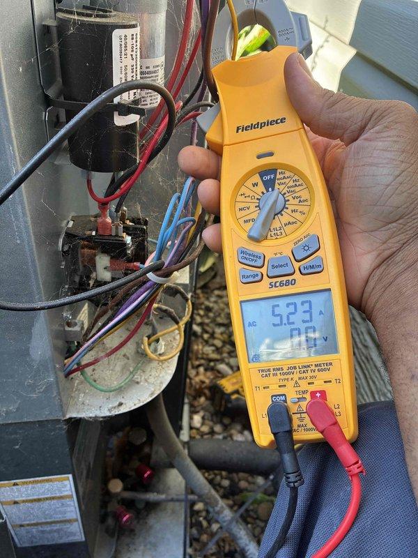 Completed scheduled preventive maintenance on residential cooling system. Performed electrical diagnostics using clamp meter, recording compressor amperage at 5.23A and system voltage at 248.7V, confirming proper electrical operation within manufacturer specifications. Inspected condenser unit, control panel wiring, and internal components; all connections secure with no visible defects noted.