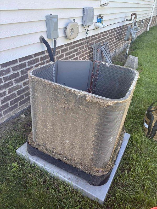 Performed chemical coil cleaning on outdoor condensing unit that exhibited heavy dirt, debris, and organic matter accumulation on exterior surfaces and coil fins. Restored unit to proper operating condition by removing years of environmental buildup that was restricting airflow and reducing system efficiency.