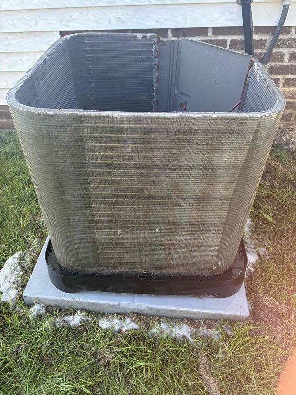 Performed chemical coil cleaning on outdoor condensing unit that exhibited heavy dirt, debris, and organic matter accumulation on exterior surfaces and coil fins. Restored unit to proper operating condition by removing years of environmental buildup that was restricting airflow and reducing system efficiency.