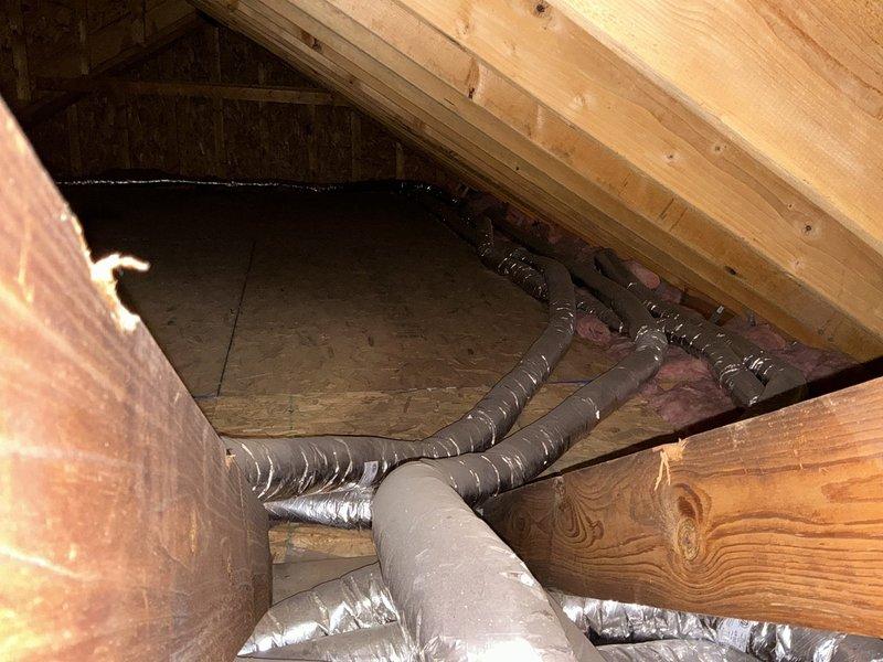 Conducted on-site assessment of existing Unico HVAC system located in attic crawl space to provide replacement options for baseboard heating system currently under repair. Documented equipment configuration including air handler unit, flexible ductwork installation, and existing baseboard heater to develop comprehensive replacement proposal for customer consideration.