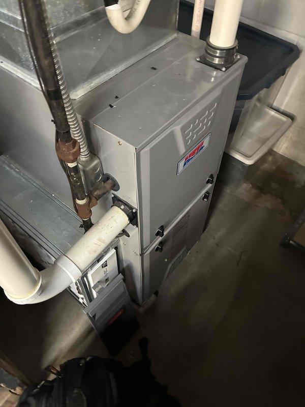 Responded to customer report of water leaking from basement air conditioning system. Upon arrival, performed comprehensive inspection of indoor HVAC unit and associated components. Examined furnace, evaporator coil assembly, condensate drainage system, and control board for potential issues causing water discharge. Assessed copper refrigerant lines, insulation integrity, and PVC condensate piping for proper installation and function. Documented system condition with detailed photography of equipment installation, including furnace unit, condensate pump, ductwork connections, and electronic control board components. Customer indicated outdoor condenser unit sustained possible hail damage requiring separate evaluation. System appears to be recent installation based on equipment condition and configuration observed during inspection.