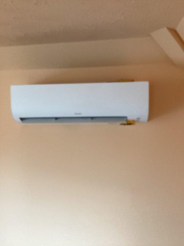 Completed routine maintenance on a ductless mini-split cooling system, including inspection of the indoor wall-mounted air handler unit and outdoor electrical disconnect box. Verified proper electrical connections, examined refrigerant line set integrity, and confirmed system operation. All components found to be in good working condition with no issues identified.