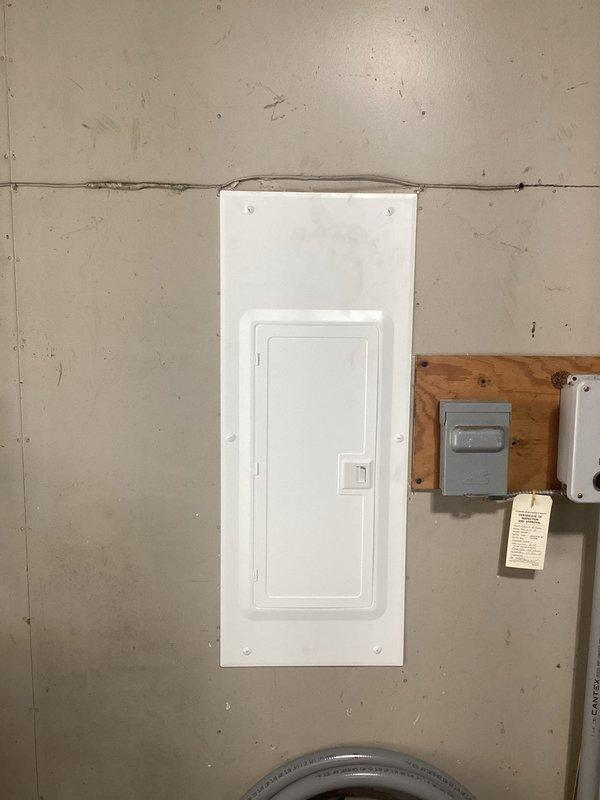 Replaced existing 150-amp main electrical panel with new NEC-compliant service panel, including installation of new interior breaker box with dual circuit breaker arrays and exterior meter base with disconnect switch mounted on wooden backing board. All electrical connections, branch circuits, and main service conductors were properly terminated and secured in accordance with current National Electrical Code requirements.