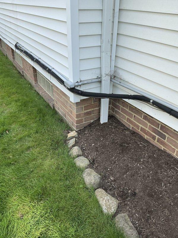 Conducted on-site evaluation of existing residential air conditioning system to provide replacement options. Assessed current outdoor condensing unit located on concrete pad with proper clearances and drainage, documented equipment specifications and installation conditions. Photographed existing system configuration including electrical disconnect, refrigerant line set routing, and equipment accessibility for accurate replacement proposal preparation.