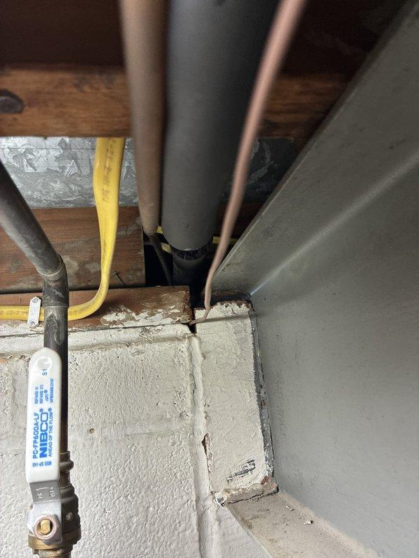 Conducted comprehensive diagnostic evaluation of existing HVAC system and presented full replacement options to homeowner. Assessed current equipment condition including furnace, air conditioning unit, and associated ductwork in basement mechanical space. Reviewed system accessibility, utility connections, and exterior condenser placement. Documented existing installation configuration including plumbing interfaces, electrical service panel proximity, and ventilation routing through foundation wall for replacement planning purposes.