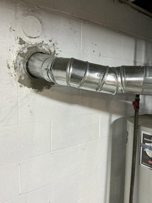 Conducted comprehensive HVAC system replacement estimate consultation for large residential property exceeding 3000 square feet with basement-mounted equipment utilizing natural gas energy source. Presented three-tier system replacement options featuring complete heating and cooling solutions, including Good tier system with up to 13.4 SEER air conditioning unit paired with 80% AFUE gas furnace, Better tier system offering up to 14 SEER cooling with 96% AFUE high-efficiency furnace, and Best tier premium system providing up to 16 SEER air conditioning with 96% AFUE gas furnace for optimal energy performance. Documented existing mechanical infrastructure including electrical service panel with labeled circuits for HVAC equipment, kitchen appliances, lighting, dryer, disposal, sump pump, and range, noting current system connections and power supply configuration. Inspected and photographed existing ductwork penetration through concrete block foundation wall, observing galvanized metal su