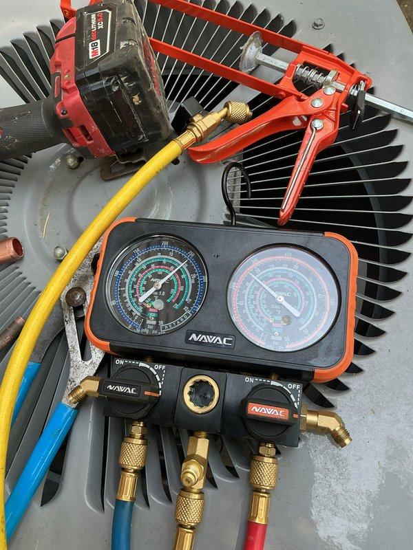 Relocated residential condenser unit to new position on concrete pad against exterior wall. Evacuated refrigerant system using manifold gauge set, disconnected electrical and refrigerant lines, repositioned unit, and reconnected all components. Recharged system to manufacturer specifications and verified proper operation of compressor and fan assembly.