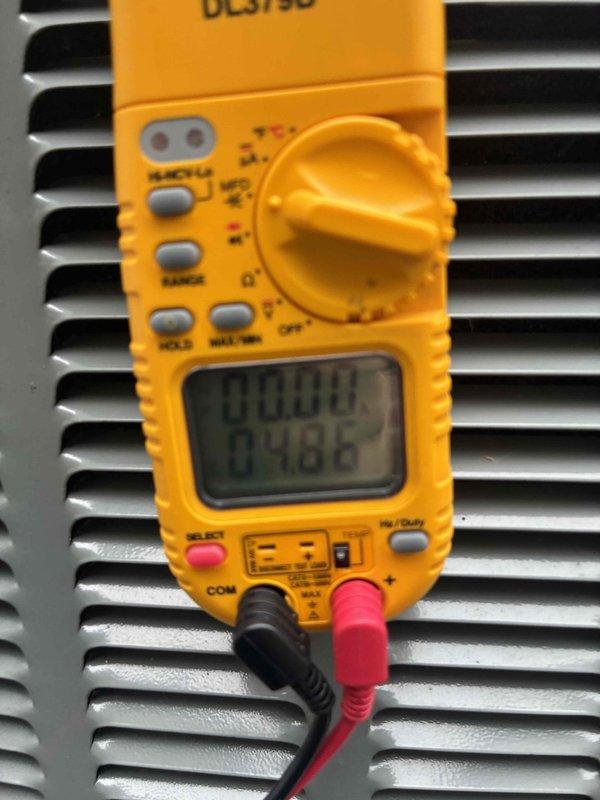 Completed scheduled cooling maintenance on residential air conditioning system. Performed electrical diagnostics using digital multimeter to verify proper voltage and amperage readings at the outdoor condensing unit. Inspected and documented control panel components including CoreSense monitoring device, transformer connections, and low-voltage wiring harness to ensure all electrical connections were secure and functioning within manufacturer specifications.