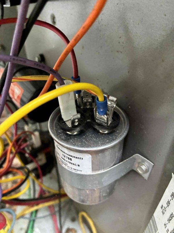 Completed scheduled preventive maintenance on residential cooling system. Inspected electrical components including capacitor connections and verified proper wire terminations with all connections secure and intact. Measured supply air temperature at 53°F, confirming adequate cooling performance and proper system operation.