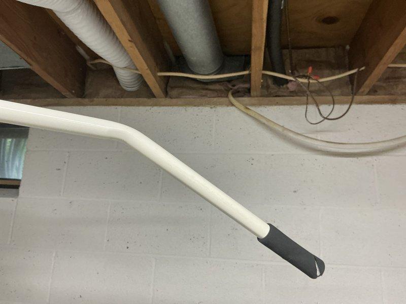 Completed estimate for replacement of 1978 R22 gas heating system with heat pump conversion. Customer previously operated heat pump system in 1995 and requested return to heat pump technology due to refrigerant leak in existing unit. Assessed basement mechanical room with exposed framing and utility area, documented existing HVAC equipment and infrastructure, and provided quote for complete system replacement including electrical panel upgrade required for heat pump installation.