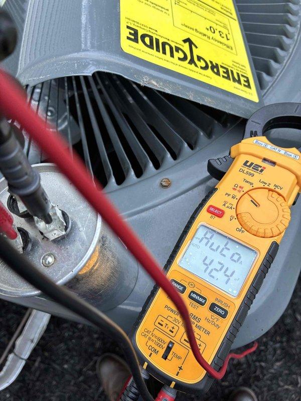 Performed comprehensive preventive maintenance on HVAC cooling system. Conducted electrical diagnostics using digital multimeter, recording motor voltage readings at 424V to verify proper electrical supply and motor operation. Inspected and tested dual-run capacitor rated at 45/5μF at 440VAC, confirming capacitance values within acceptable tolerance range and secure terminal connections. Evaluated condenser unit components including compressor housing, cooling fins, and blower motor assembly for proper operation and physical condition.