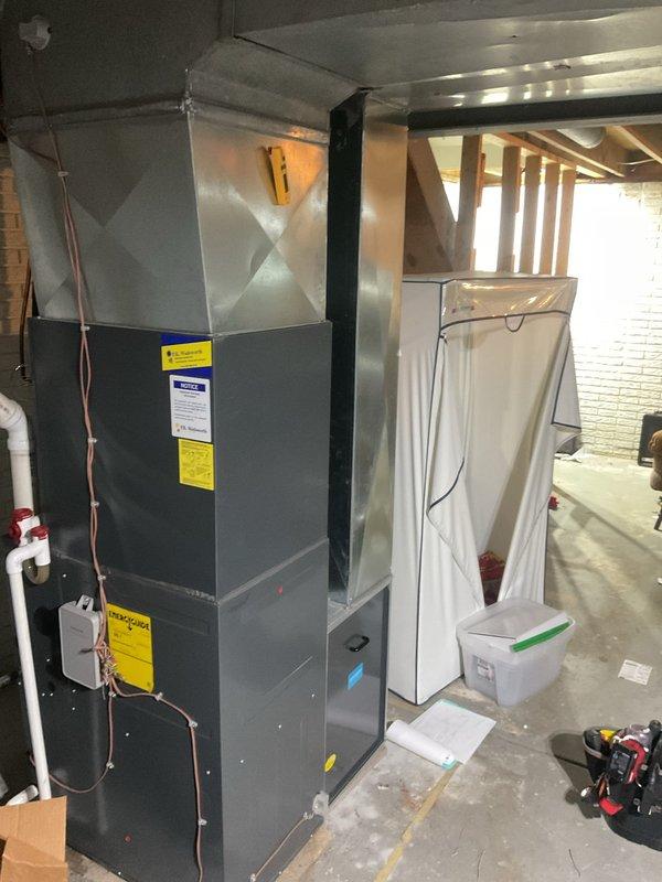 Completed comprehensive cooling maintenance on residential HVAC system located in basement utility area. Performed standard preventative maintenance procedures including inspection of air handler unit, verification of refrigerant line integrity, and examination of electrical components including capacitor and CoreSense Diagnostics monitoring system. All components found to be operating within normal parameters with proper wire connections secured and system functioning as designed.
