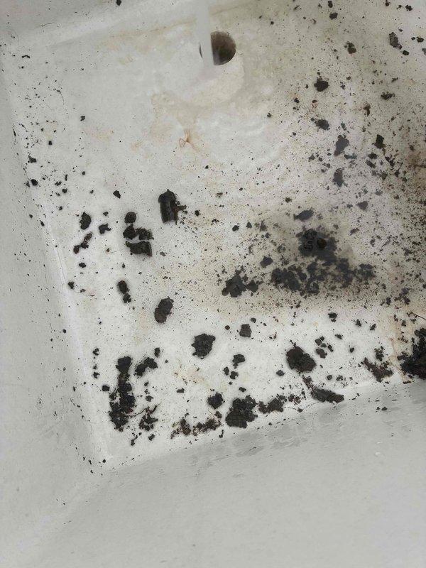 Responded to service call for A/C unit freezing up and causing interior water leakage. Upon inspection, discovered extensive mold growth and water damage on interior surfaces around air handler area, with heavy contamination visible on walls and ceiling. Evidence of prolonged moisture intrusion and biological growth indicates ongoing condensate drainage issue or refrigerant system malfunction causing excessive freeze conditions. Documented conditions with photographs showing significant deterioration requiring remediation. Escalated to senior technician for advanced diagnostics and defrost system evaluation to determine root cause of freezing coil and water overflow.