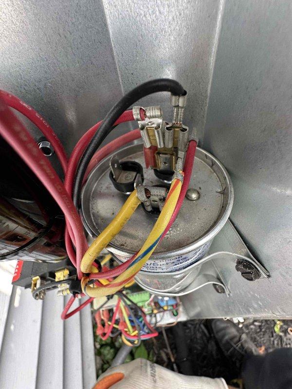 Completed scheduled preventive maintenance on residential cooling system. Performed comprehensive inspection of condensing unit including electrical connections, capacitor, and refrigerant lines. Observed rust formation at ductwork seam connections indicating moisture exposure; documented condition for monitoring. All electrical terminals secure, capacitor within normal parameters, and unit operating within manufacturer specifications at time of service.