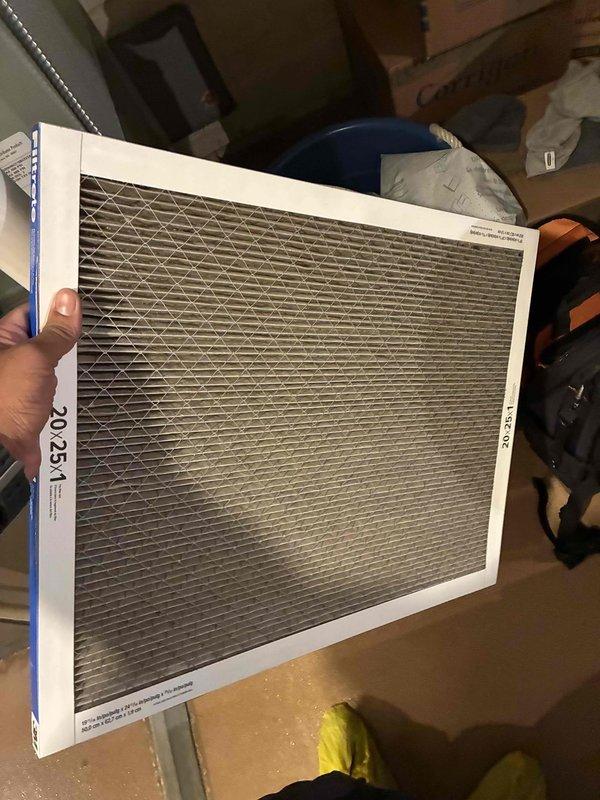 Completed seasonal cooling tune-up on residential HVAC system. Replaced heavily soiled 20x25x1 pleated air filter showing significant dust accumulation and discoloration. Performed electrical diagnostics on outdoor condensing unit using digital multimeter, verified proper voltage readings and system operation with all components functioning within normal parameters.