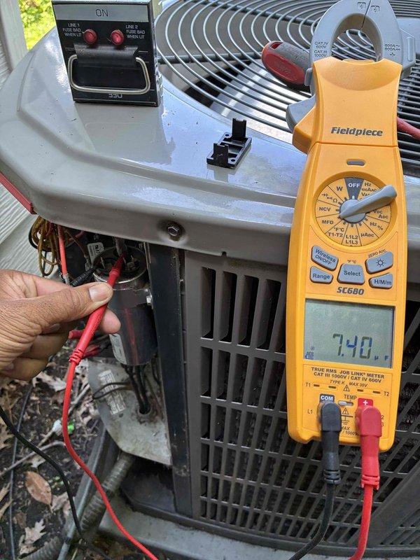 Completed seasonal cooling tune-up on residential HVAC system. Replaced heavily soiled 20x25x1 pleated air filter showing significant dust accumulation and discoloration. Performed electrical diagnostics on outdoor condensing unit using digital multimeter, verified proper voltage readings and system operation with all components functioning within normal parameters.
