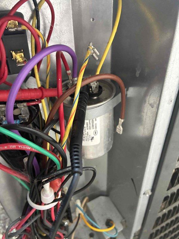 Completed routine cooling system maintenance as part of recurring service plan. Inspected electrical components within air handler cabinet, including capacitor and wiring connections at terminal blocks. Verified system electrical readings using digital multimeter to ensure proper voltage and amperage levels across all circuits.