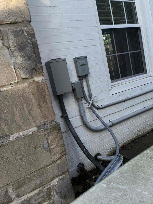 Completed comprehensive HVAC cooling system maintenance on 8-unit system. Performed electrical diagnostics using clamp meter to verify proper amperage draw and system performance, inspected exterior condensing unit components and electrical connections at building-mounted junction boxes, and documented all findings with photos to confirm system is operating within manufacturer specifications.
