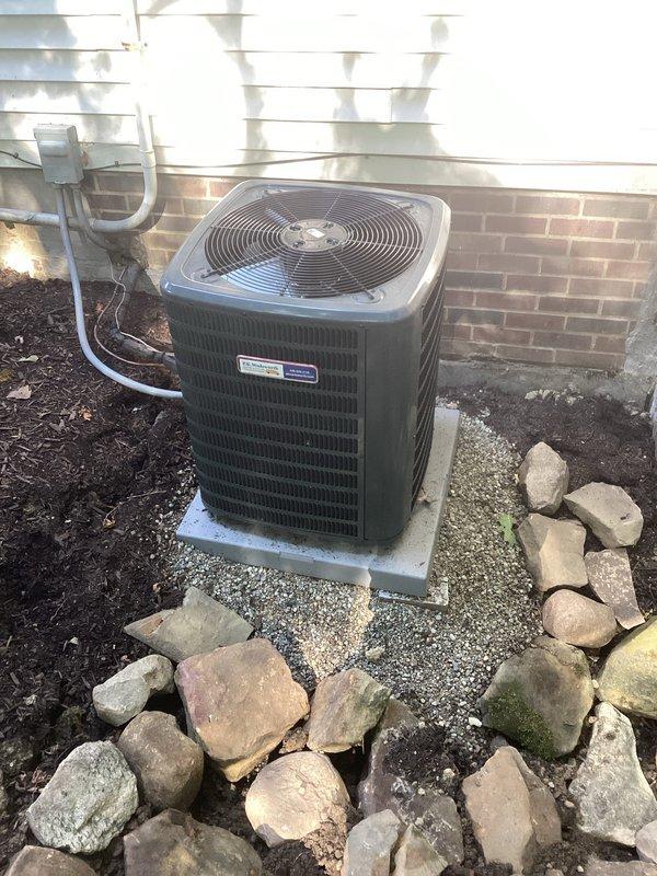 Completed comprehensive cooling system maintenance on residential outdoor condenser unit. Upon arrival, inspected AC unit positioning in response to concern about unit leaning following previous uninstallation and reinstallation. Verified unit placement on concrete pad, confirmed level positioning, and assessed structural stability of installation. Unit found to be properly seated on pad with adequate clearance from building structure for optimal airflow. Performed standard preventive maintenance procedures including visual inspection of condenser housing, fan grille assembly, refrigerant line connections, and electrical conduit. Confirmed proper drainage line routing and verified landscaping clearances around unit perimeter remain adequate for system performance. All components operating within normal parameters with no immediate concerns identified regarding unit stability or positioning.