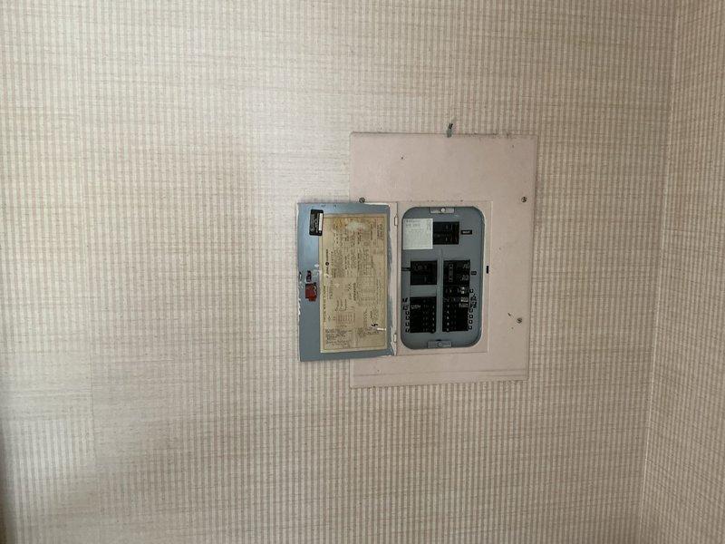 Conducted site evaluation for heat pump installation to replace existing oil furnace system and add air conditioning capability. Assessed electrical panel capacity and configuration to determine compatibility with new heat pump equipment. Evaluated existing return air grille location and ductwork accessibility for integration with proposed HVAC system.