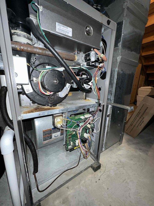 Completed first-year cooling maintenance on HVAC system. Performed comprehensive inspection of outdoor condenser unit, checking electrical components including fuses and connections. Inspected indoor furnace assembly, verifying blower motor operation, control board functionality, and all wiring connections. All components found operating within normal parameters with no issues identified during this preventive maintenance visit.