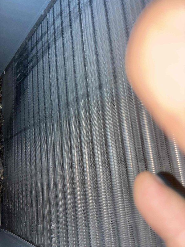 Performed thorough inspection and cleaning of evaporator coil and condensate drip pan per customer request. Coil fins were found to be in good condition with proper spacing and metallic integrity intact, showing no signs of corrosion or damage. Completed maintenance service and documented equipment condition with photographs for service records.